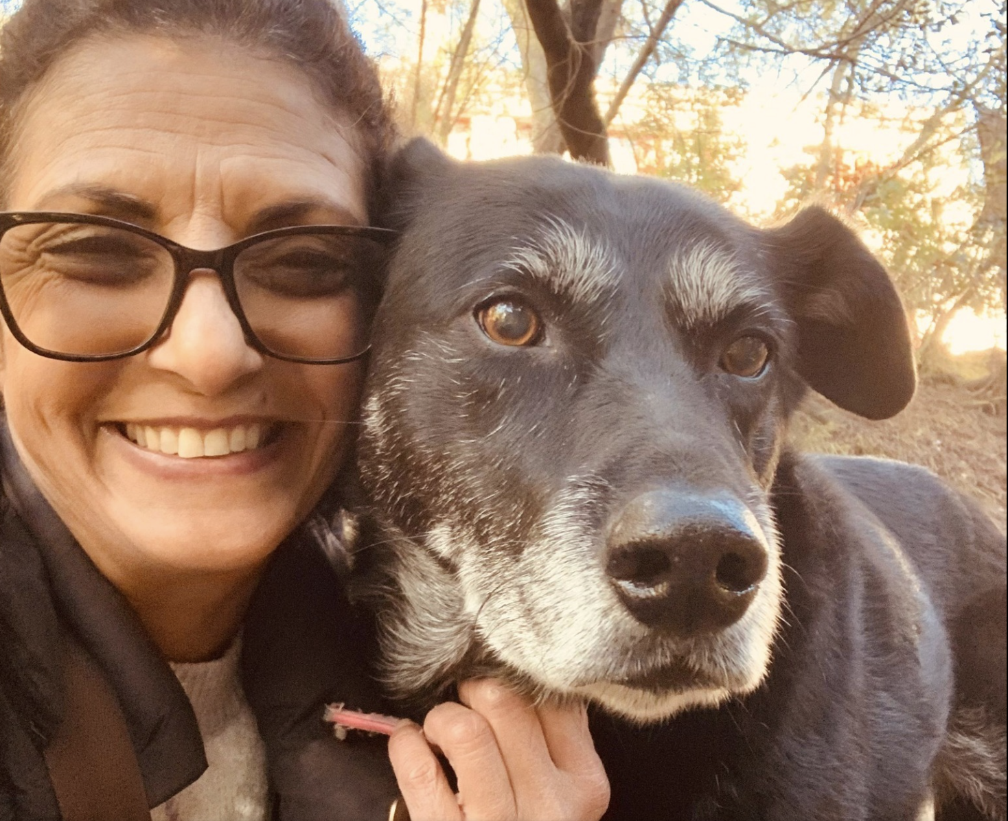 The owner of Doggli Pet Care with a beloved dog